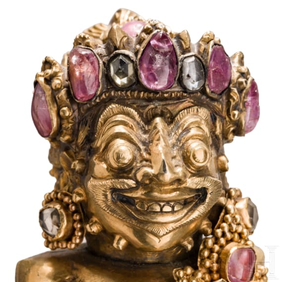 A Bali kris handle in the form of Bataru Bayu with a star sapphire, circa 1900