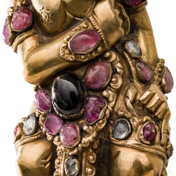 A Bali kris handle in the form of Bataru Bayu with a star sapphire, circa 1900
