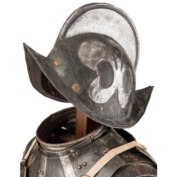 A South German black and white armour for a man-at-arms, circa 1600