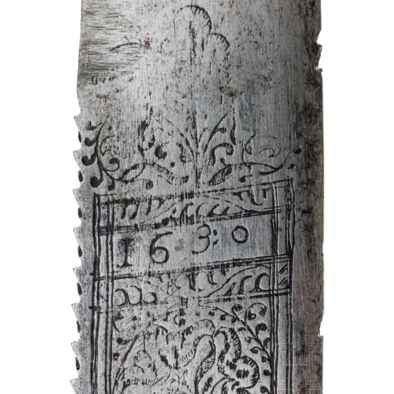 A short English cutlass with silver-damascened hilt, dated 1630
