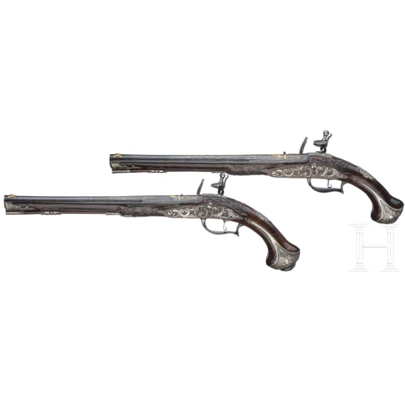 A fine pair of flintlock pistols from the armoury of the Duke of Bavaria, Charles Albert (1726-45), by Johann Gottfried Kolbe of Suhl, circa 1740