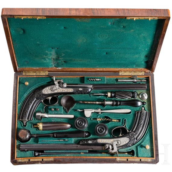 A cased pair of fine ebony stocked percussion pistols by Anton Krebs of Vienna, circa 1860