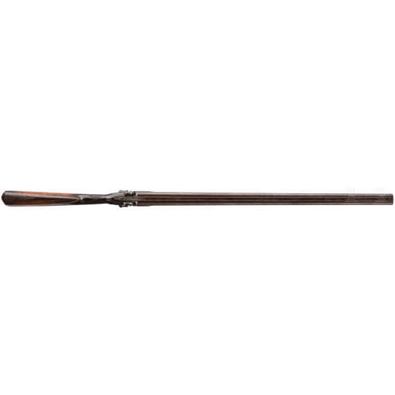 A side-by-side shotgun by J. Manton in London, with case