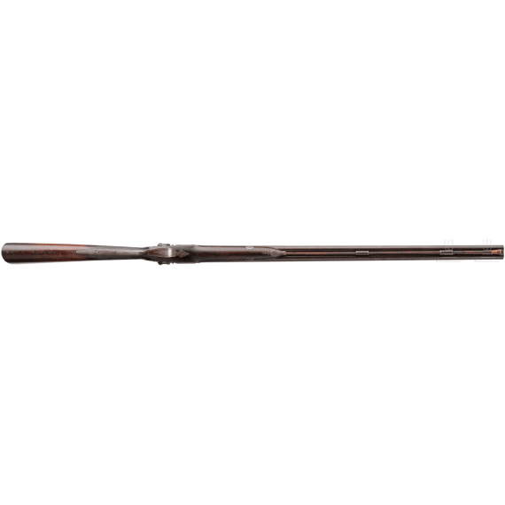 A side-by-side shotgun by J. Manton in London, with case
