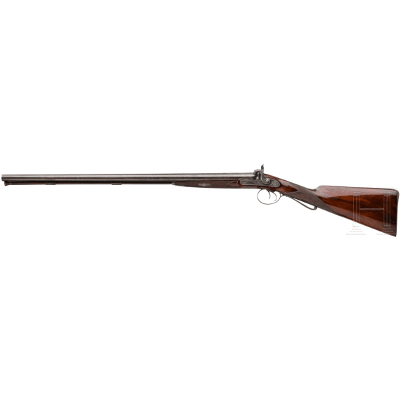A side-by-side percussion shotgun by Purdey, with case