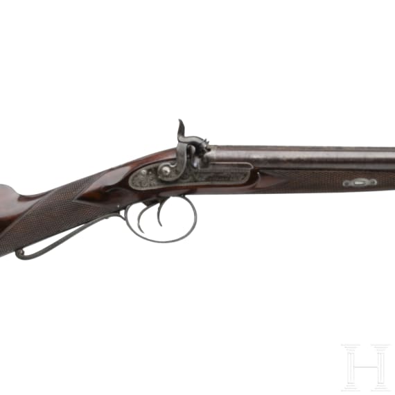 A side-by-side percussion shotgun by Purdey, with case