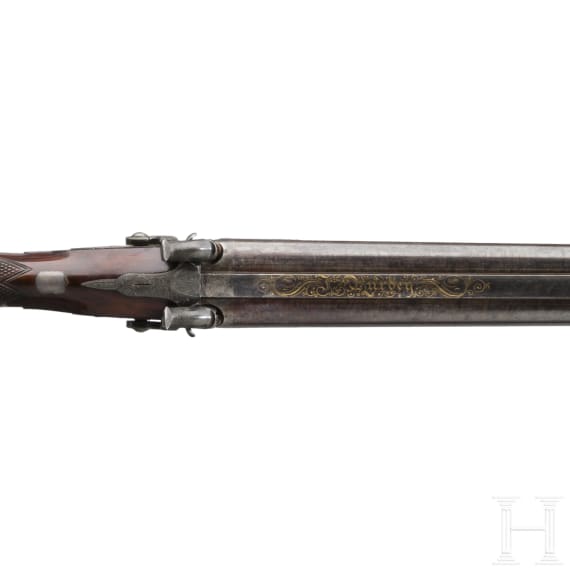 A side-by-side percussion shotgun by Purdey, with case