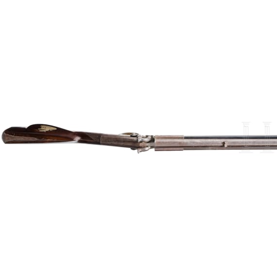 An over and under percussion rifle