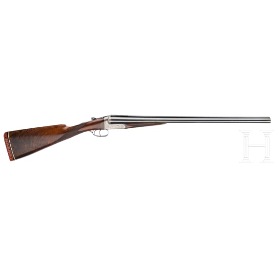 A cased side-by-side shotgun by Churchill, London