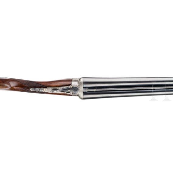 A cased side-by-side shotgun by Churchill, London