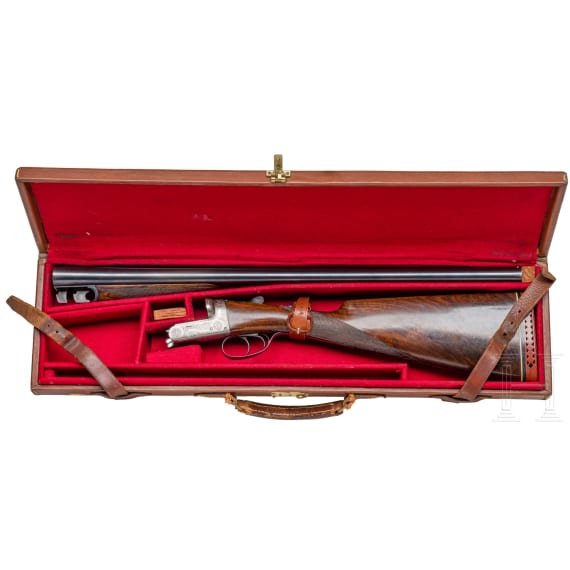 A cased side-by-side shotgun by Churchill, London