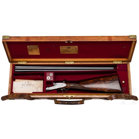 A side-by-side shotgun by Purdey & Sons, London, in case