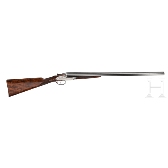 A side-by-side shotgun by Purdey & Sons, London, in case
