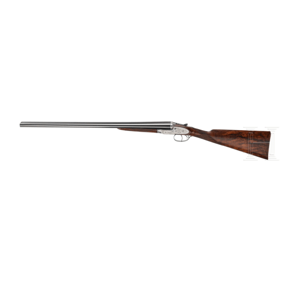 A side-by-side shotgun by Purdey & Sons, London, in case