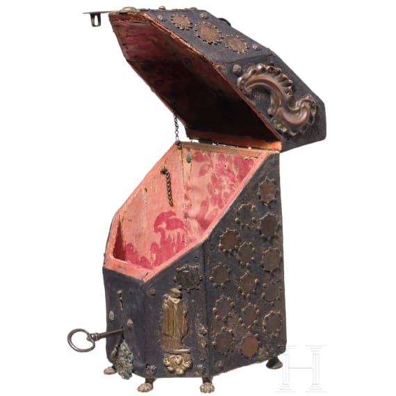 A copper and coin-mounted leather cutlery casket