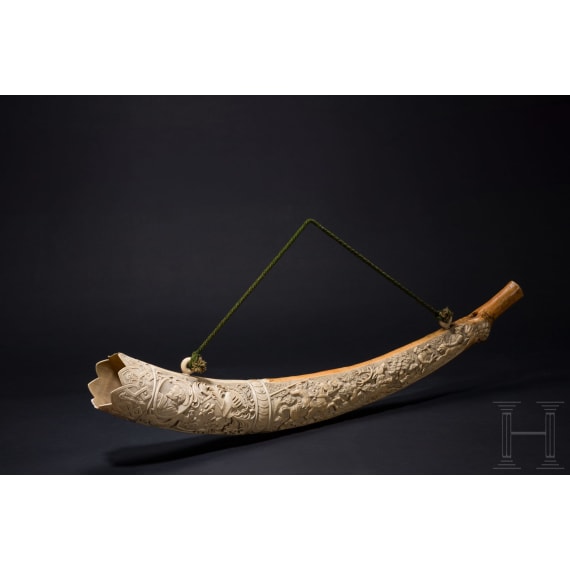 A large, finely carved German ivory olifant with portraits of the French kings Fran&ccedil;ois I and Henri II and a hunting scene, mid-19th century