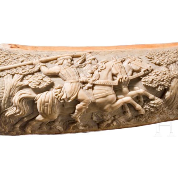 A large, finely carved German ivory olifant with portraits of the French kings Fran&ccedil;ois I and Henri II and a hunting scene, mid-19th century