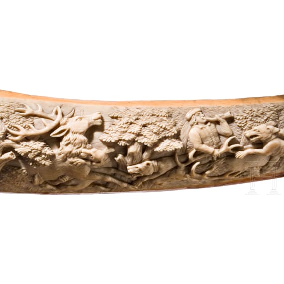 A large, finely carved German ivory olifant with portraits of the French kings Fran&ccedil;ois I and Henri II and a hunting scene, mid-19th century