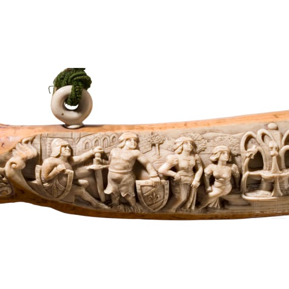 A large, finely carved German ivory olifant with portraits of the French kings Fran&ccedil;ois I and Henri II and a hunting scene, mid-19th century