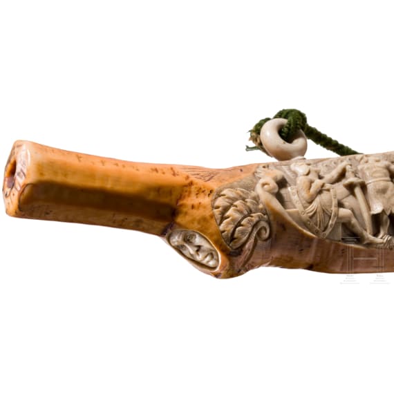 A large, finely carved German ivory olifant with portraits of the French kings Fran&ccedil;ois I and Henri II and a hunting scene, mid-19th century