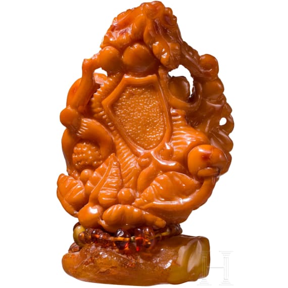 A figural amber carving showing a mother with her child