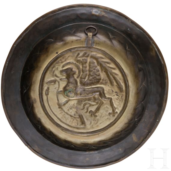 A small brass alms dish, Nuremberg, mid-16th century