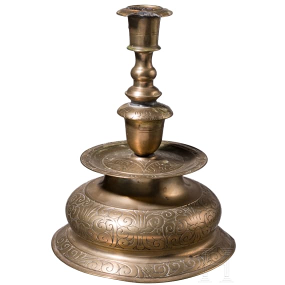 A large engraved Nuremberg brass bell-bottom candlestick, ca. 1670/80