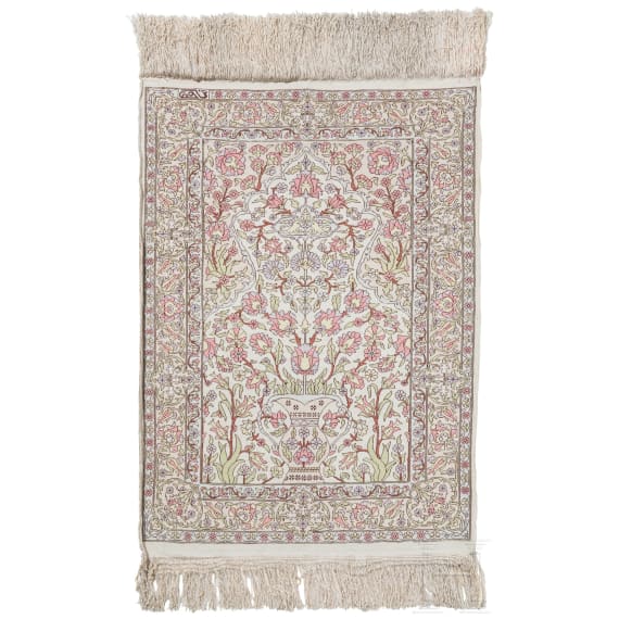 A small silk carpet, Persia, probably Ghom, 1950s/70s