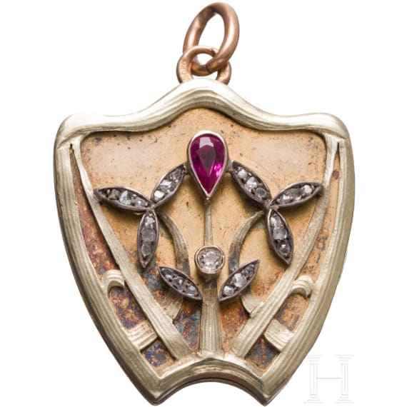 A Russian 18ct gold medallion set with ruby and diamonds