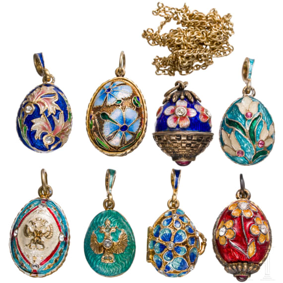 Eight Russian silver-gilt and enamelled egg-pendants, 20th century
