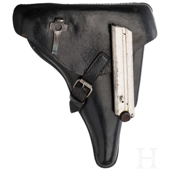 A Luger pistol by DWM, 1916, with holster