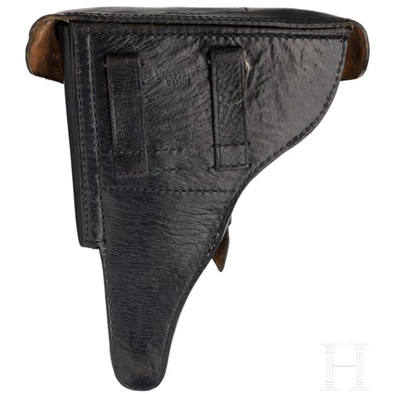 A Luger pistol by DWM, 1916, with holster