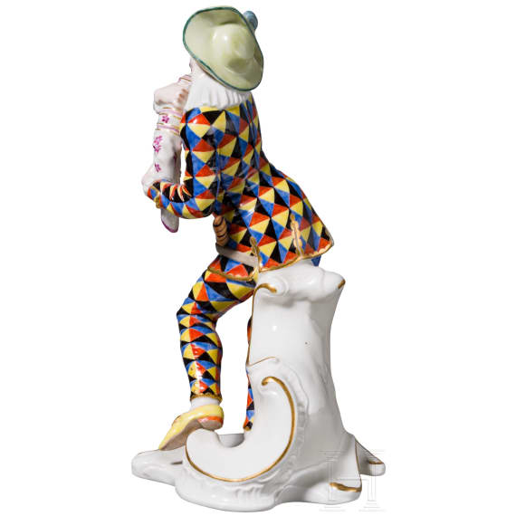 A porcelain figure of Mezzetin as a harlequin holding a baby monkey from the Commedia dell'arte series, Franz Anton Bustelli, circa 1760 (design), Nymphenburg, 20th century