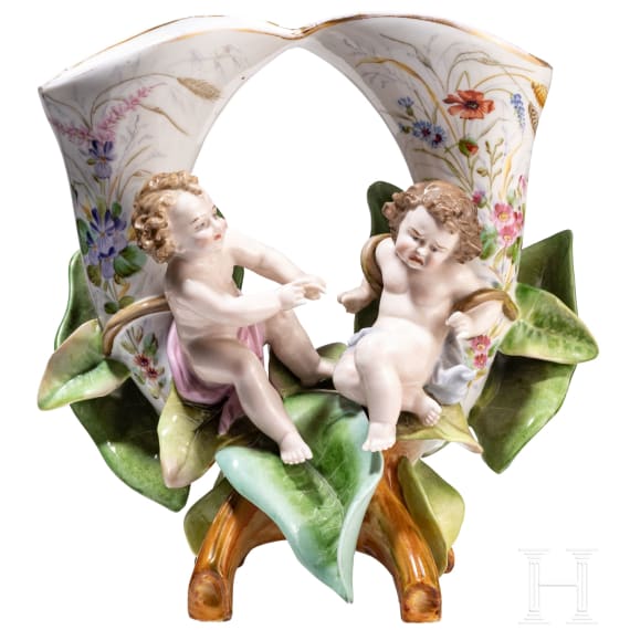 A porcelain double vase with putti on flowers, 20th century