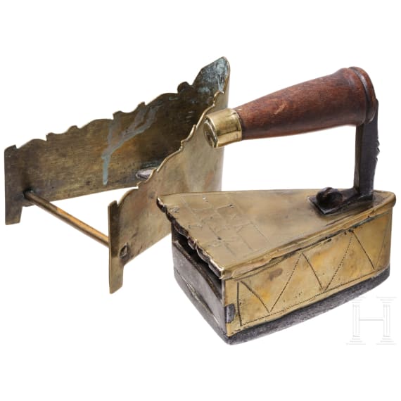 A Dutch/Scandinavian iron with stand, dated 1832