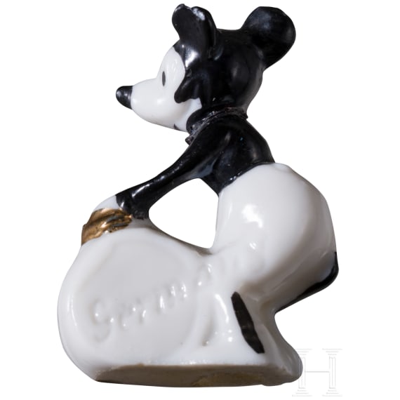Six German porcelain Mickey Mouse figures and a pocket knife, 1920/30s