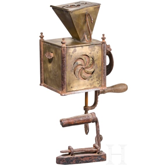 An early coffee grinder and a flatiron, probably French, dated 1864