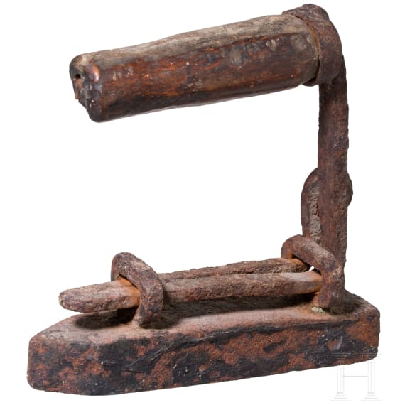 An early coffee grinder and a flatiron, probably French, dated 1864