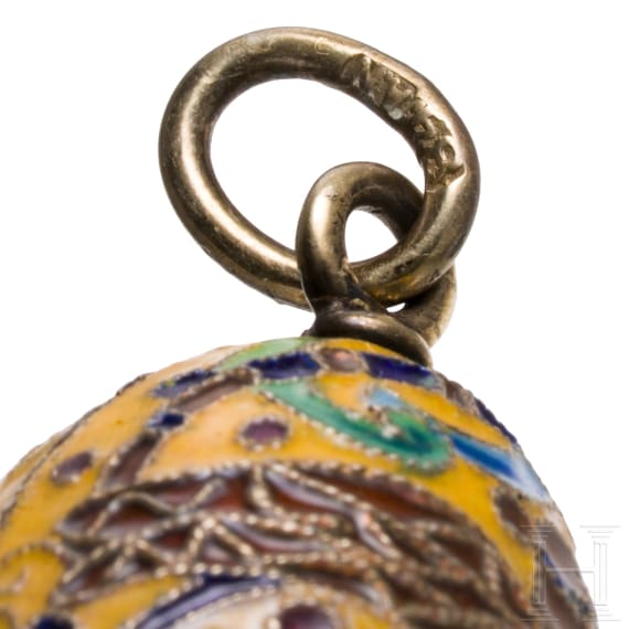 Three Russian silver and cloisonn&eacute;-enamel egg pendants, 20th century