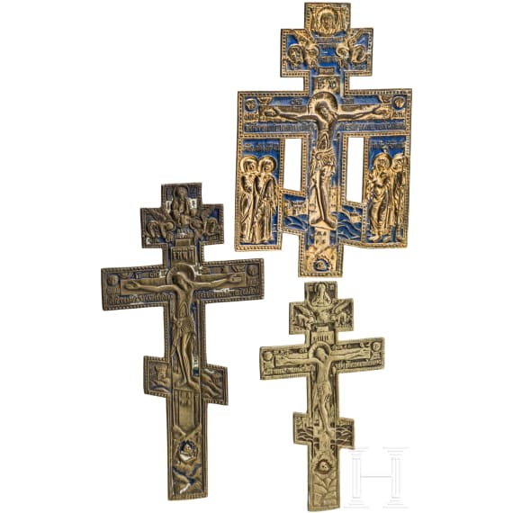Three Russian brass crucifixes (two with enamel), 19th/20th century