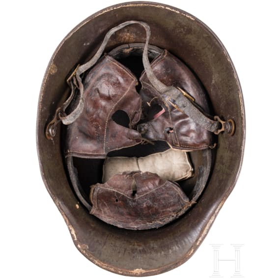 A steel helmet M 16 with remnants of camouflage paint