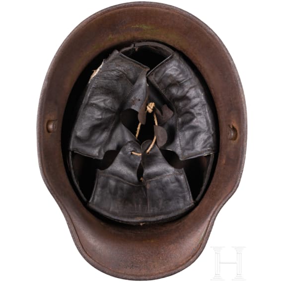 A steel helmet M 16 with remnants of camouflage paint