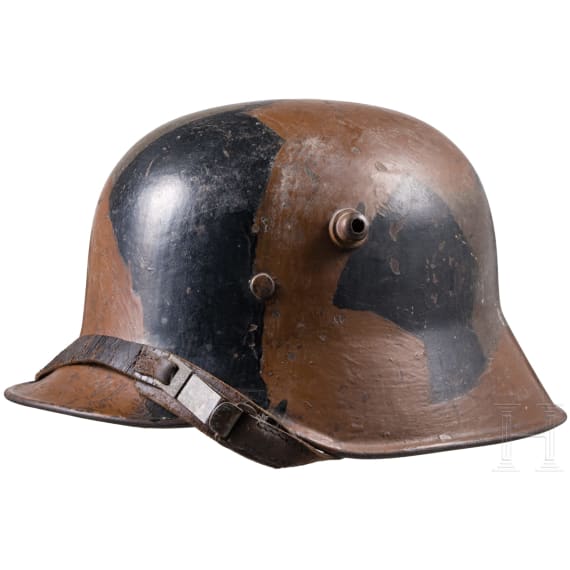 A steel helmet M 18 with camouflage painting