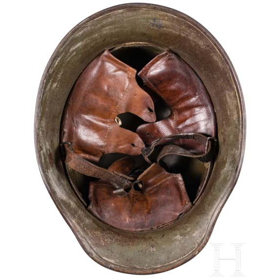 A steel helmet M 18 with camouflage painting