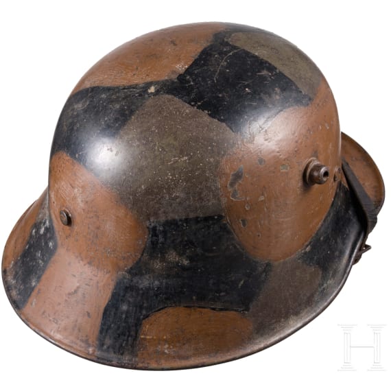A steel helmet M 18 with camouflage painting