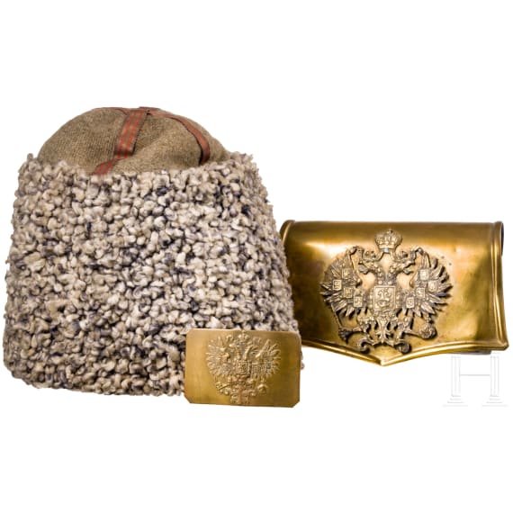 A fur hat, so-called "Papacha", a Russian belt buckle, and a cartridge box dummy