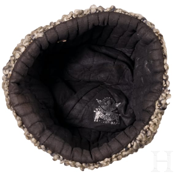 A fur hat, so-called "Papacha", a Russian belt buckle, and a cartridge box dummy