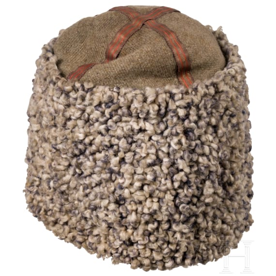 A fur hat, so-called "Papacha", a Russian belt buckle, and a cartridge box dummy