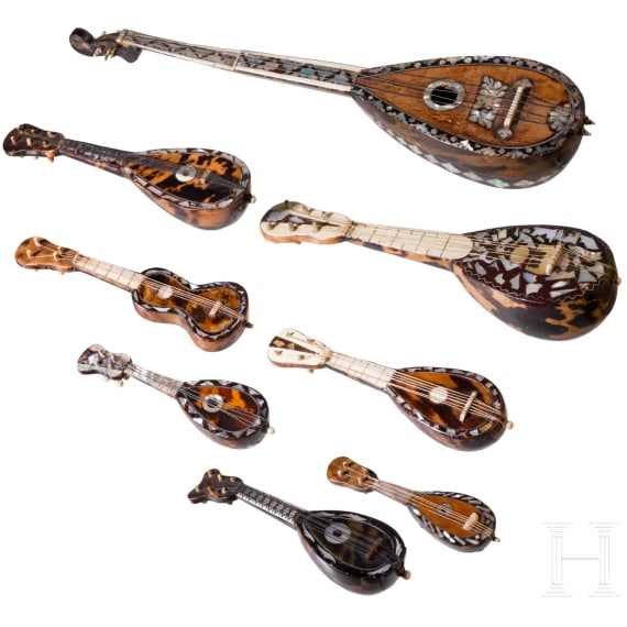 A group of seven miniature tortoiseshell and mother-of-pearl inlaid mandolins and one miniature guitar, Italy, late 19th / early 20th century