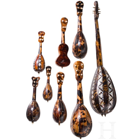 A group of seven miniature tortoiseshell and mother-of-pearl inlaid mandolins and one miniature guitar, Italy, late 19th / early 20th century